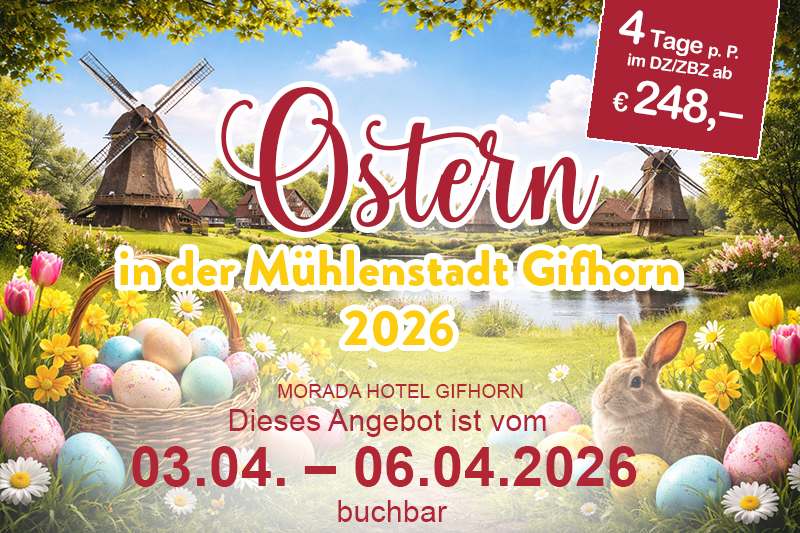 Landschaft mit mehreren historischen Windmühlen, umgeben von grüner Vegetation und Spazierwegen unter einem blauen Himmel.